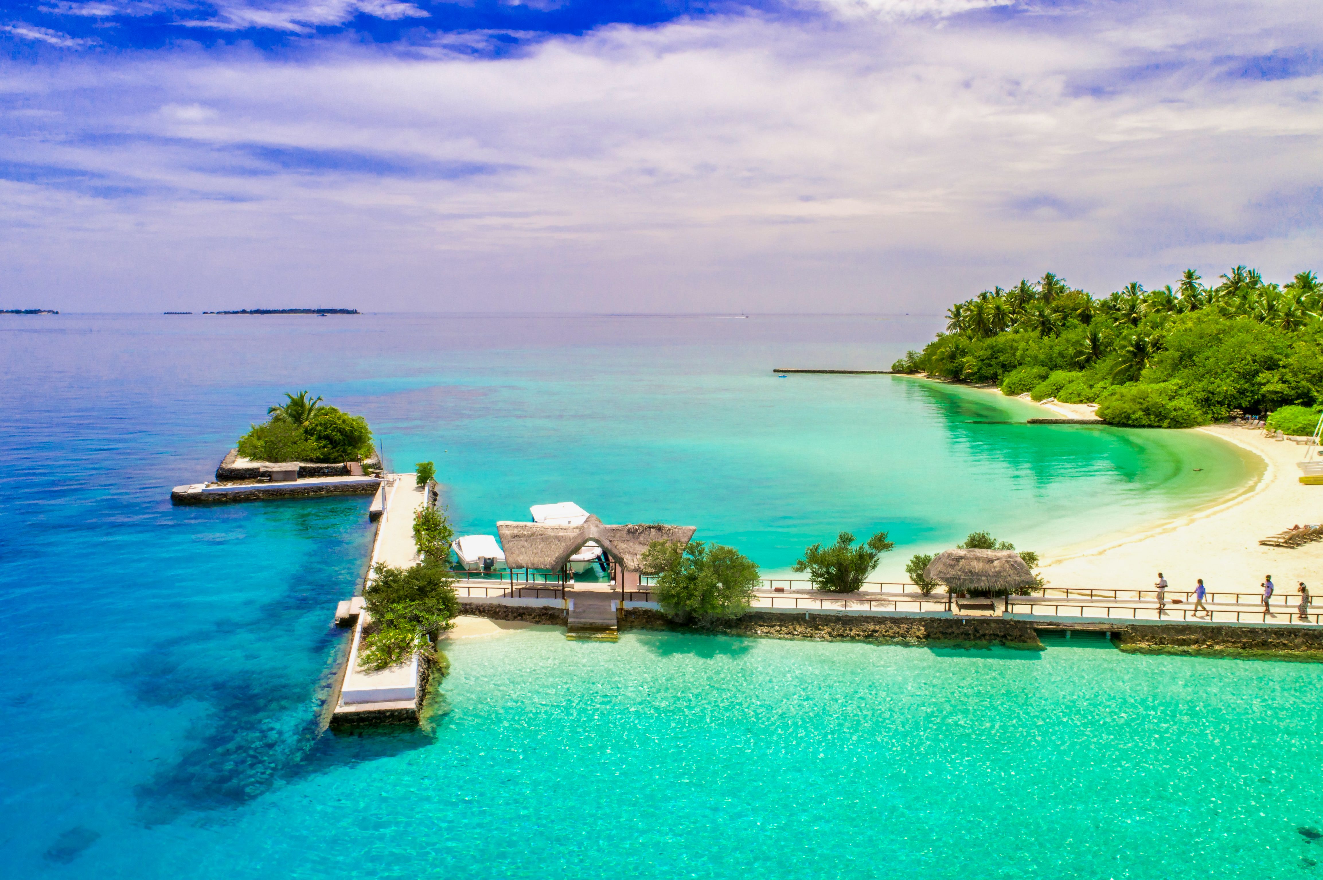 aerial view of clear blue ocean water and dock